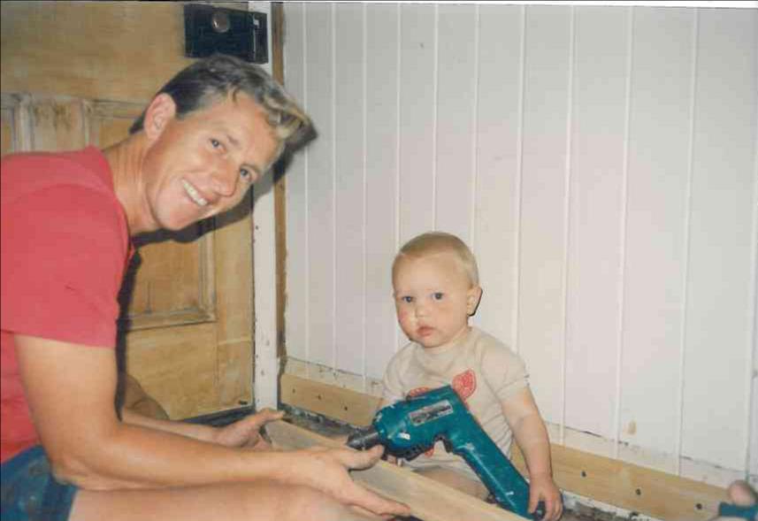 Kevin Hattin and Ray Hattin (Baby) holding a drill